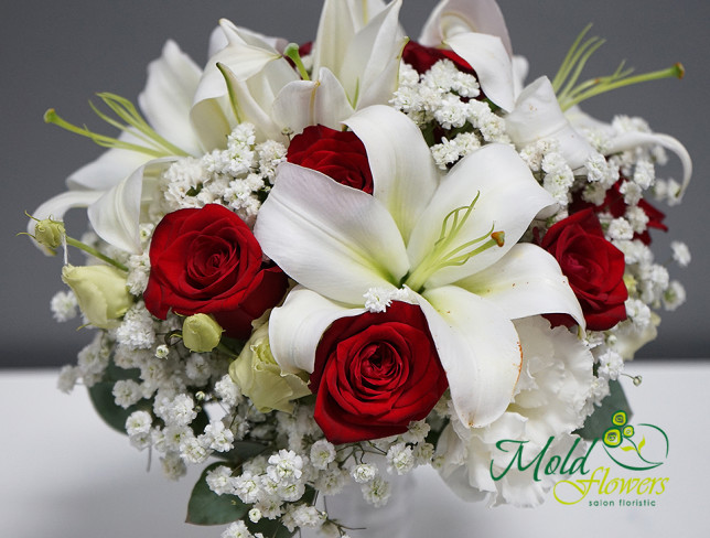Bridal bouquet of white lilies, eustoma, red roses, and gypsophila photo